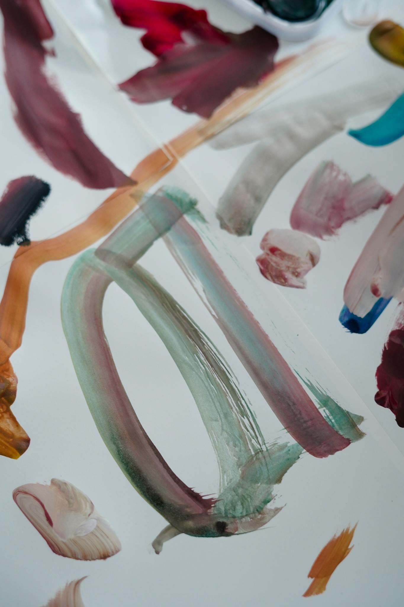 Colorful abstract paint strokes on canvas showcasing dynamic art style.
